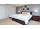 Spacious bedroom with a king bed, nightstands, and a comfortable chair at 900 Las Fuentes Dr, Kissimmee, FL 34746
