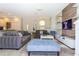 Living room with grey sofas and a large TV at 900 Las Fuentes Dr, Kissimmee, FL 34746
