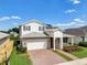 Two-story house with white accents and solar panels at 2509 Cedar Rose St, Apopka, FL 32712