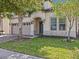 Two-story home with a two-car garage and manicured lawn at 8832 Macapa Dr, Kissimmee, FL 34747