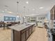 Open concept kitchen boasts granite countertops and stainless steel appliances at 8832 Macapa Dr, Kissimmee, FL 34747