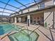 Private pool and spa with screened enclosure at 8832 Macapa Dr, Kissimmee, FL 34747