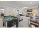 Finished basement with a foosball table and comfortable seating at 8832 Macapa Dr, Kissimmee, FL 34747