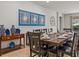 Bright dining room features a large wooden table and stylish decor at 8832 Macapa Dr, Kissimmee, FL 34747