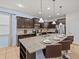 Modern kitchen with dark cabinetry and a large island at 8832 Macapa Dr, Kissimmee, FL 34747