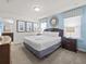 Spacious bedroom with a king-size bed and ensuite bathroom at 8832 Macapa Dr, Kissimmee, FL 34747