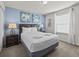 Bedroom with a queen-size bed and dark brown leather headboard at 8832 Macapa Dr, Kissimmee, FL 34747