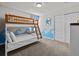 bedroom with a bunk bed and ocean-themed decor at 8832 Macapa Dr, Kissimmee, FL 34747