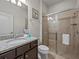 Clean bathroom with granite vanity, shower, and toilet at 8832 Macapa Dr, Kissimmee, FL 34747