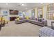 Spacious basement recreation area with sectional sofa and wet bar at 8832 Macapa Dr, Kissimmee, FL 34747