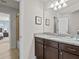 Bathroom with granite countertop, single sink, and shower at 8832 Macapa Dr, Kissimmee, FL 34747