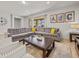 Bright living room featuring a comfortable sectional sofa and access to a patio at 8832 Macapa Dr, Kissimmee, FL 34747