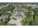 Aerial view of resort-style water park with slides and multiple pools at 7659 Whisper Way # 102, Reunion, FL 34747
