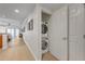 Stackable washer and dryer in a well-lit laundry room at 7659 Whisper Way # 102, Reunion, FL 34747