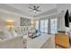 Comfortable living room with hardwood floors and plenty of natural light at 7659 Whisper Way # 102, Reunion, FL 34747