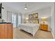 Spacious primary bedroom with a king-size bed and plenty of natural light at 7659 Whisper Way # 102, Reunion, FL 34747