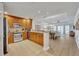 Modern kitchen with stainless steel appliances and light wood cabinets at 7659 Whisper Way # 102, Reunion, FL 34747
