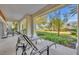 Spacious patio with lounge chairs and small table, great for relaxing at 7659 Whisper Way # 102, Reunion, FL 34747