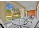 Relaxing patio with seating area, overlooking a park-like setting at 7659 Whisper Way # 102, Reunion, FL 34747