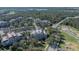 An aerial view of the building and its surrounding landscape at 7659 Whisper Way # 102, Reunion, FL 34747
