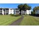 Two-story condo building with green lawn at 8209 Sun Spring Cir # 22, Orlando, FL 32825