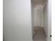 Hallway with built-in storage and laminate flooring at 8209 Sun Spring Cir # 22, Orlando, FL 32825