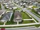Aerial view of a house with solar panels and a large backyard in a residential neighborhood at 6275 Hamlin Reserve Blvd, Winter Garden, FL 34787
