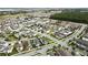 Aerial view of a large residential neighborhood, highlighting a single home at 6275 Hamlin Reserve Blvd, Winter Garden, FL 34787