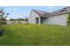 Large backyard with grassy area and solar panels at 6275 Hamlin Reserve Blvd, Winter Garden, FL 34787