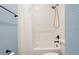 Updated bathroom with white tile, bathtub and shower at 6275 Hamlin Reserve Blvd, Winter Garden, FL 34787