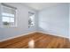 Bright bedroom with hardwood floors and two large windows at 6275 Hamlin Reserve Blvd, Winter Garden, FL 34787