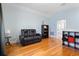 Bonus room with hardwood floors, recessed lighting, and comfortable seating at 6275 Hamlin Reserve Blvd, Winter Garden, FL 34787