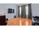 Bright bonus room with hardwood floors, large windows, and space for entertainment at 6275 Hamlin Reserve Blvd, Winter Garden, FL 34787