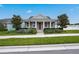Gray craftsman style home with front porch and landscaped yard at 6275 Hamlin Reserve Blvd, Winter Garden, FL 34787