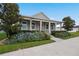 Gray craftsman style home with front porch and landscaped yard at 6275 Hamlin Reserve Blvd, Winter Garden, FL 34787