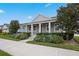 Gray craftsman style home with front porch and landscaped yard at 6275 Hamlin Reserve Blvd, Winter Garden, FL 34787