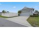 Attached garage with driveway and a landscaped yard at 6275 Hamlin Reserve Blvd, Winter Garden, FL 34787