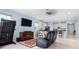 Open concept Gathering room with a view into the kitchen at 6275 Hamlin Reserve Blvd, Winter Garden, FL 34787