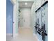 Bright hallway with storage and fishing rod display at 6275 Hamlin Reserve Blvd, Winter Garden, FL 34787