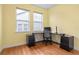Home office with hardwood floors, corner desk, and built-in storage at 6275 Hamlin Reserve Blvd, Winter Garden, FL 34787
