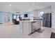 Modern kitchen with island, stainless steel appliances, and light blue cabinets at 6275 Hamlin Reserve Blvd, Winter Garden, FL 34787