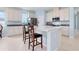 Modern kitchen with island, stainless steel appliances, and light blue cabinets at 6275 Hamlin Reserve Blvd, Winter Garden, FL 34787