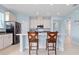 Modern kitchen with island, stainless steel appliances, and light blue cabinets at 6275 Hamlin Reserve Blvd, Winter Garden, FL 34787