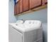 Laundry room with washer, dryer, and additional storage at 6275 Hamlin Reserve Blvd, Winter Garden, FL 34787