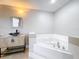 Relaxing bathroom with corner soaking tub and modern vanity at 790 Silhouette Ct, Longwood, FL 32750