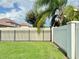 Private backyard with a fenced enclosure and grassy lawn at 8426 Morehouse Dr, Orlando, FL 32836