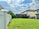 Large backyard with green lawn and privacy fence at 8426 Morehouse Dr, Orlando, FL 32836