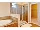 Bathroom with shower, tub, and walk-in closet at 8426 Morehouse Dr, Orlando, FL 32836