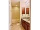 Clean bathroom with double vanity, tub, and tile flooring at 8426 Morehouse Dr, Orlando, FL 32836