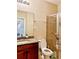Bathroom with granite vanity, shower, and toilet at 8426 Morehouse Dr, Orlando, FL 32836